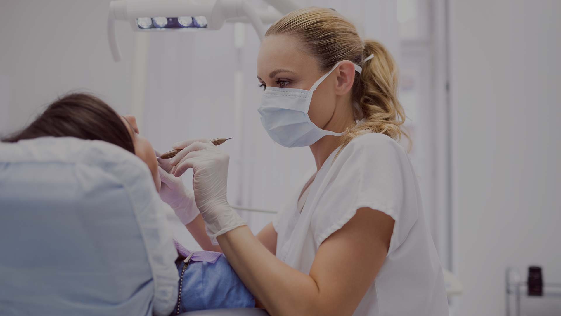 Home 2 dentist examining female patient